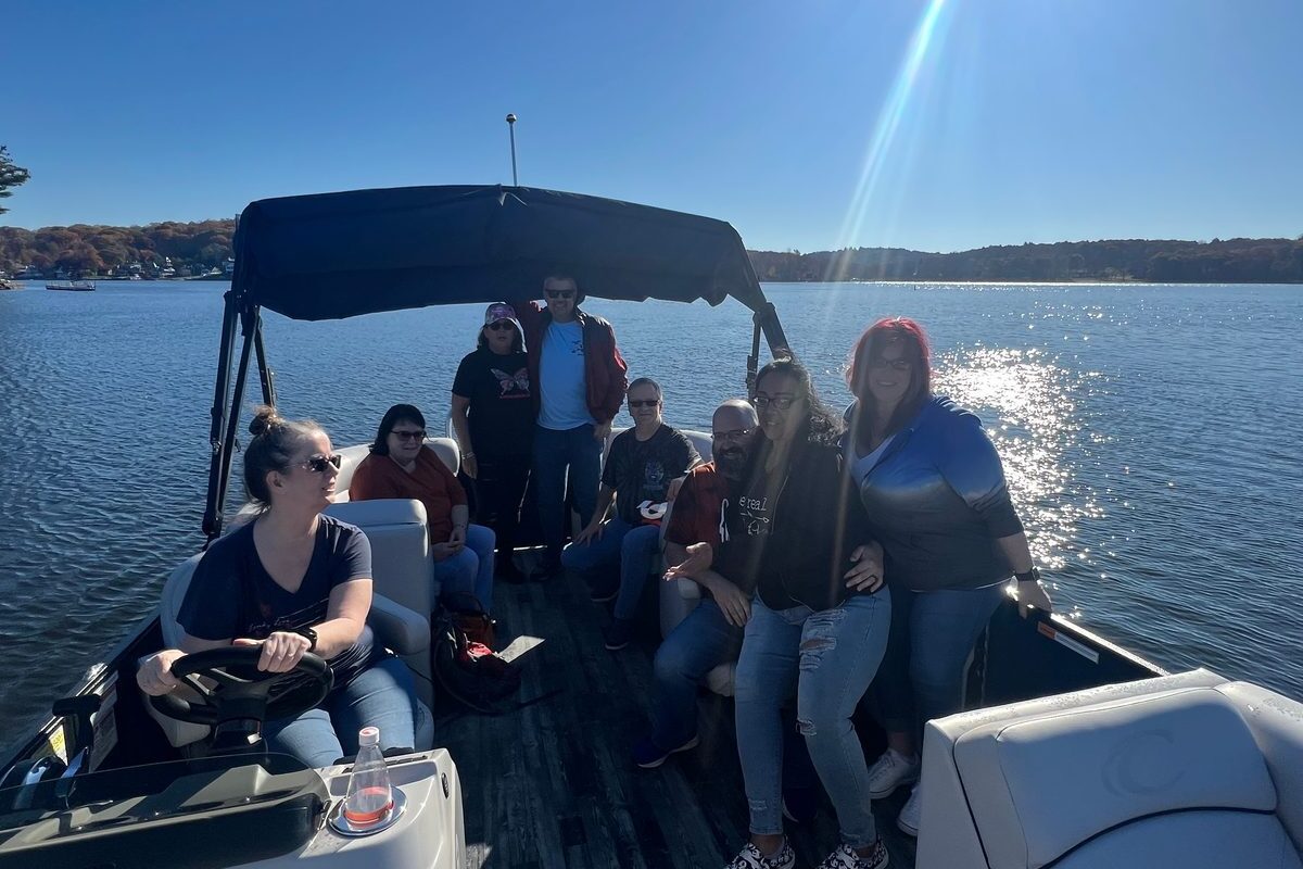 Fishing off the back of a boat on Woodridge Lake in Goshen